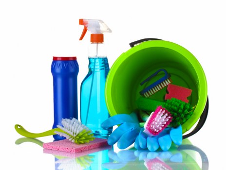Carpet cleaning technician preparing equipment with safety focus
