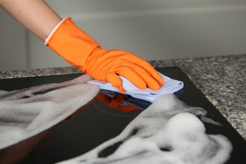 Carpet cleaning team working safely with equipment and protective measures